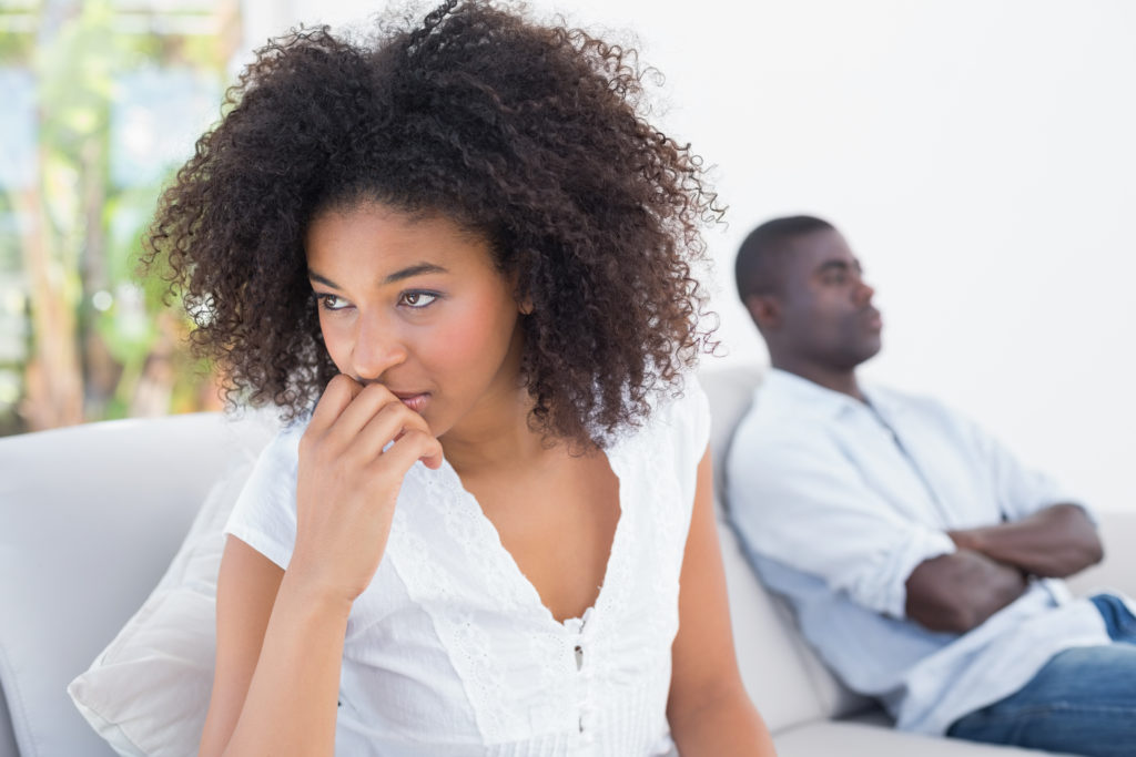 A close up of a woman looking away from her partner with a concerned expression. This could represent the concerns a premarital counselor in Phoenix, AZ can offer support by searching for couples therapy in Phoenix, AZ or Scottsdale. Search for “counseling phoenix” for support today.
