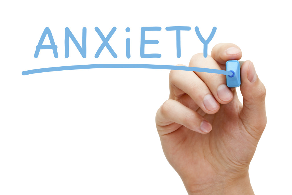 A hand writes anxiety on a clear whiteboard. Learn more about the support an anxiety therapist in Arcadia, AZ can offer for overcoming anxiety symptoms. Search for online anxiety treatment in Arcadia, AZ to learn more.
