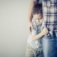 A child holds on to their parent tight. Learn how an anxiety therapist in Arcadia, AZ can offer support for you and your child. Learn more by searching for online anxiety treatment in Arcadia, AZ today.